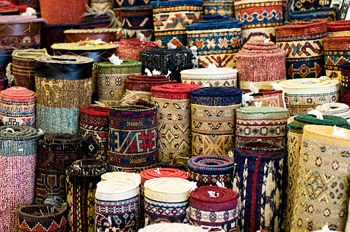 Collection of different traditional rugs.