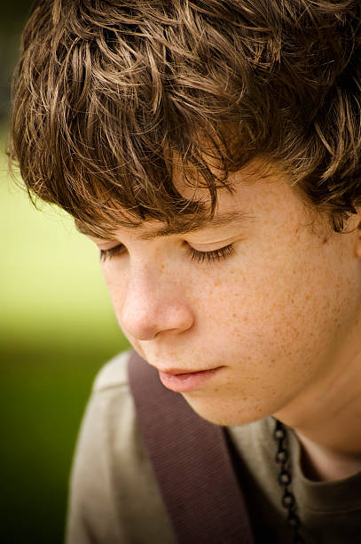 Teenage Boy Closeup Thoughtful Portrait stock photo