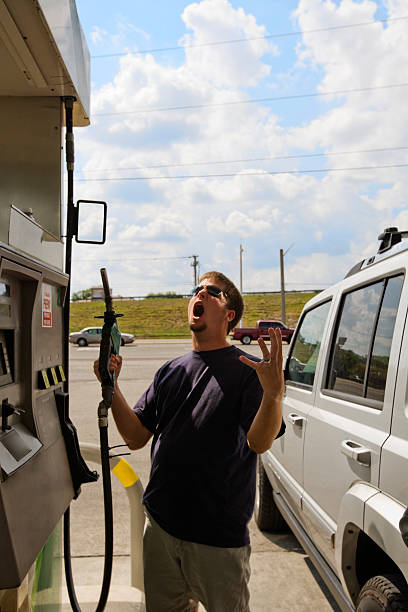 istock High Gas Price Frustration Man Refueling 157336551