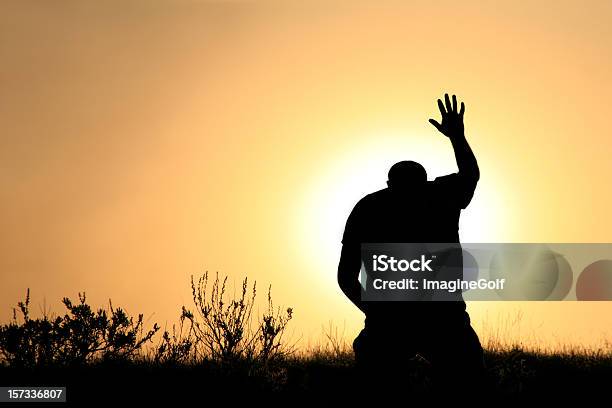 Silhouette Of Man In Praise And Worship Stock Photo - Download Image Now - Praying, Men, God