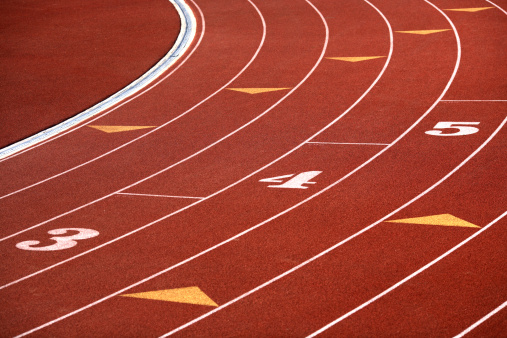 A blue running track with crisp white lines.