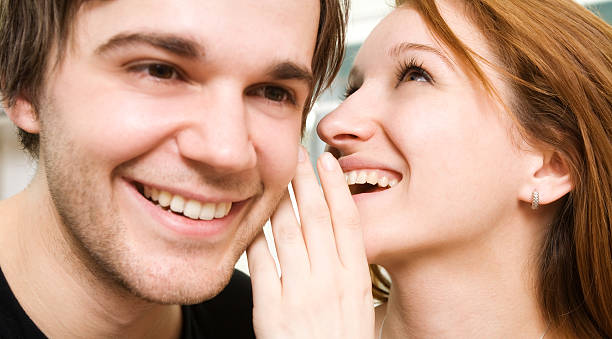 Couple Whispering stock photo