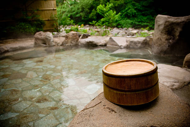 Wooden bucket by a Japanese hot spring bath stock photo