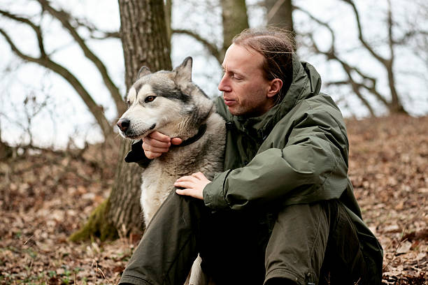 istock Dog and Man in the Woods 157337248