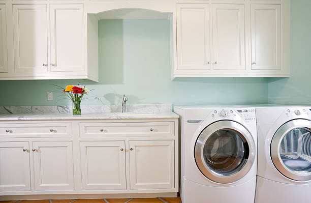 Laundry Room with Washer and Dryer Laundry/Utility room in this estate home. utility room stock pictures, royalty-free photos & images