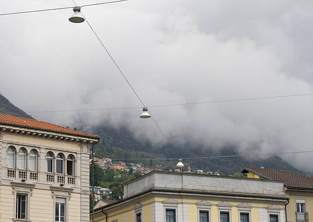 Fog rolling down mountains stock photo