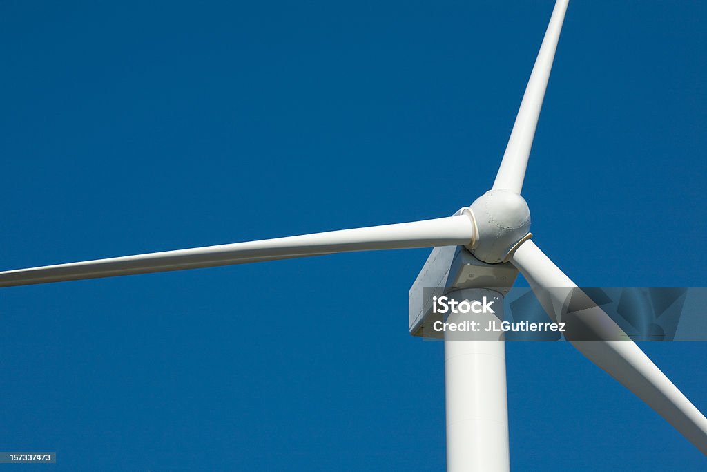 Close-up of wind turbine against blue sky Windmills close-up Blue Stock Photo