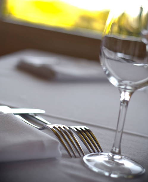 istock Restaurant Dining Table Place Setting & Wineglass on White Linen Tablecloth 157337590