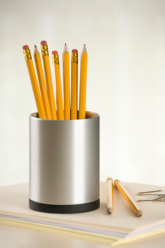 Pencils in a  pencil holder in a vertical composition