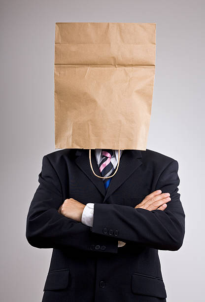 istock Man in a suit with paper bag on his head 157339014