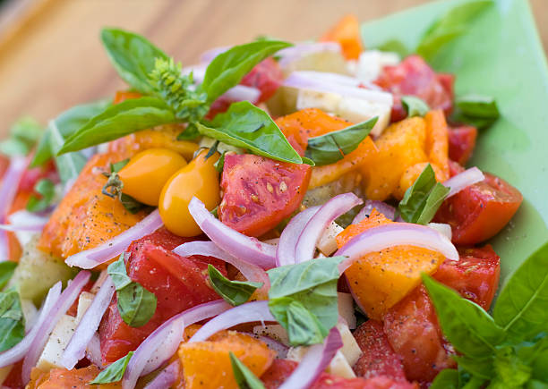 Assorted heirloom tomato and vegetable salad; with red onion, cheese & fresh basil. (SEE LIGHTBOXES BELOW for many more healthy meals, homegrown organic produce, fresh fruit & other food backgrounds...)