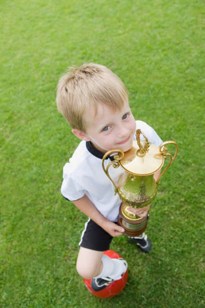 istock Boy with trophy celebrating the victory 157339146