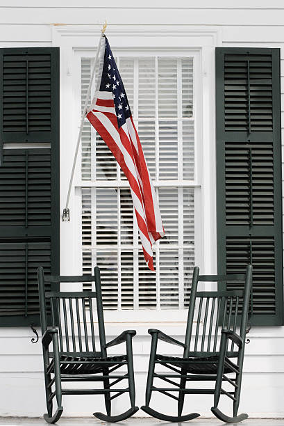 istock Two  Rocking Chairs on a Porch with American Flag 157339270