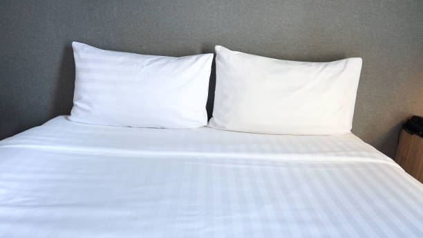 istock White cushion and white pillow as Modern bedroom interior with a stylish combination of trendy room interior image 1573419369