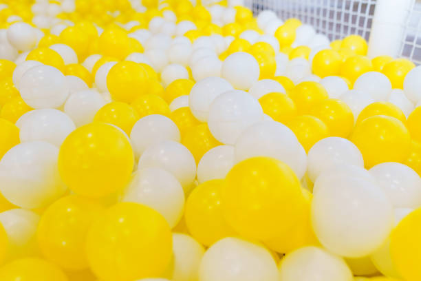 istock White and yellow plastic balls for children's dry pool. 1573424068