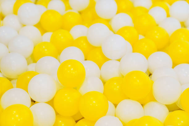 istock White and yellow plastic balls for children's dry pool. 1573424633