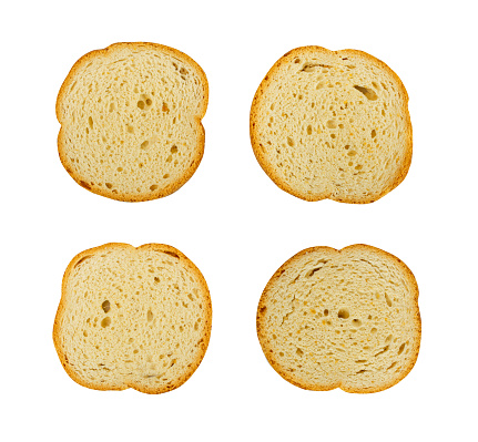 Dry Round Crackers Isolated, Sliced French Baguette Bread, Crunchy Croutons, Bruschetta Crackers, Round Rusks on White Background Top View, Clipping Path