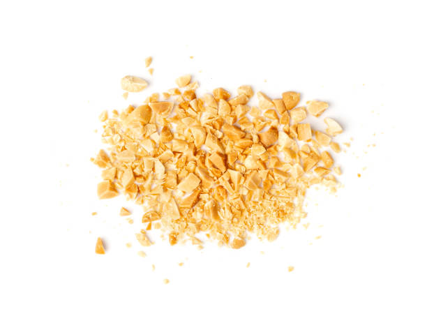 istock Crumbled Peanuts Isolated, Broken Roasted Arachis Nuts, Heap of Pea Nut Crumbs, Whole Groundnut Pieces 1573472505