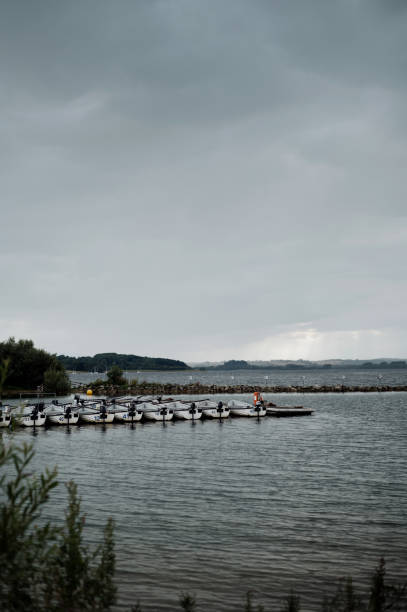 istock View on the boat station through the bushes. 1573477352