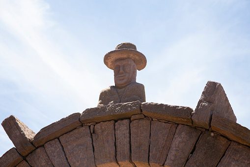 Stone heads carved into the arches on the island of Taquile on Lake Titicaca in Peru.