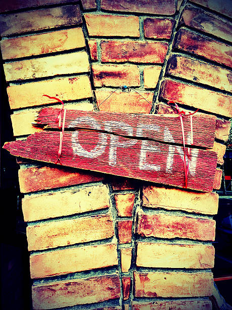 istock Wooden painted open sign on brick wall 157349833