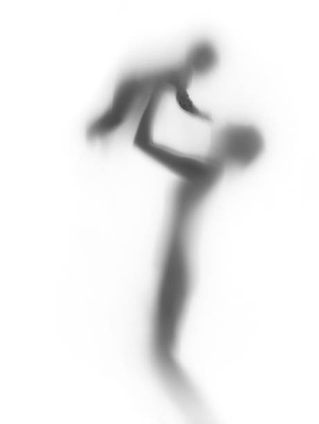istock Young mother plays with her baby, body silhouette 157350040