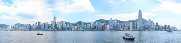 panorama of victoria harbor and hong kong island - hong kong skyline panoramic china imagens e fotografias de stock