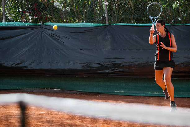 istock Professional tennis player training under the sun 1573512993