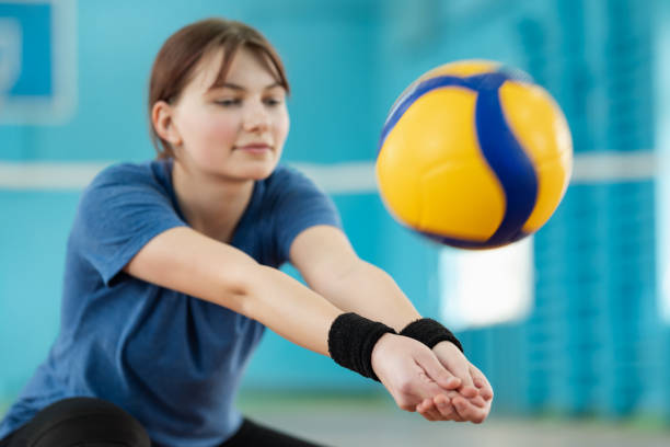 istock Practicing digging skills during volleyball training on court 1573523649