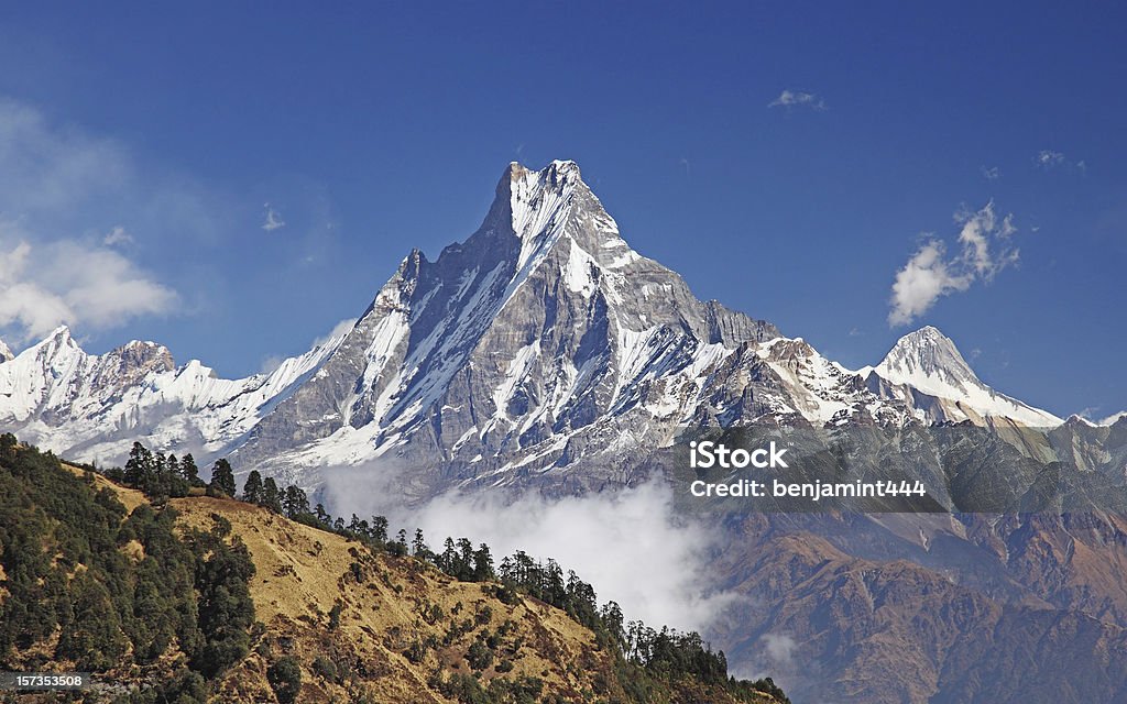 Fishtail mountain Mt Machapuchare glistening in the mid-morning sun Annapurna Range Stock Photo