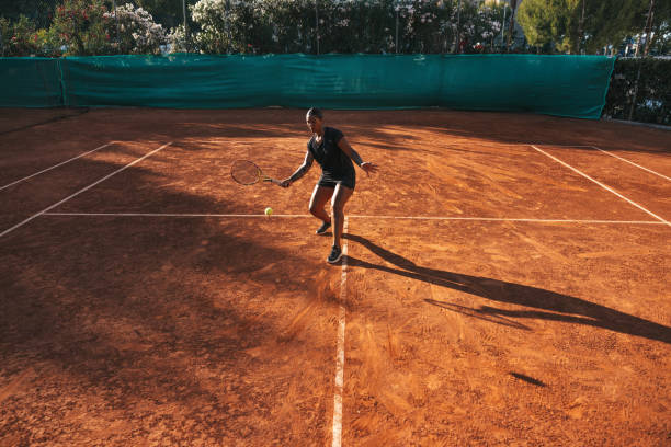 istock Professional tennis player on clay court 1573540562