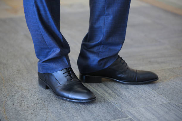 istock Businessman black leather shoes 1573561512