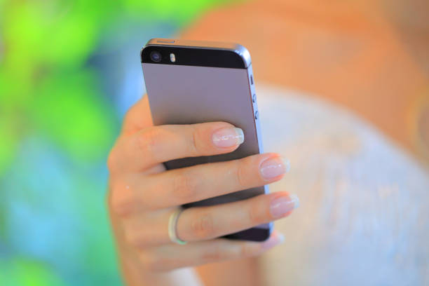 Woman using smartphone. Smartphone in a female hand.