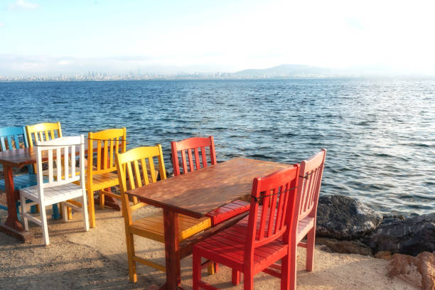istock Summer Al Fresco Dining by the Sea 1573571118