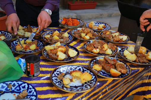 Preparation of Dimlama. The dish is done. Bukhara. Uzbekistan.