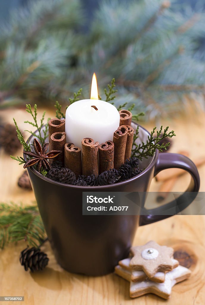 Christmas ornaments Homemade Christmas decoration for table made with candle, cinnamon sticks, fir tree and coffee mug Arranging Stock Photo