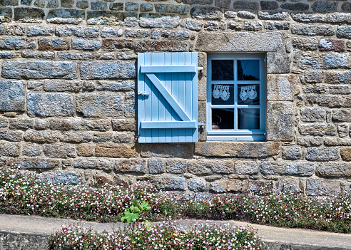 A typical blue window and shutter in Brittany, France.