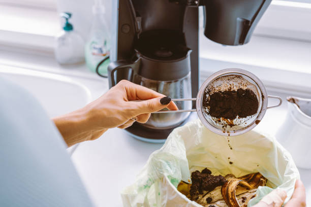 istock Throwing Away Used Coffee Ground 1573597535
