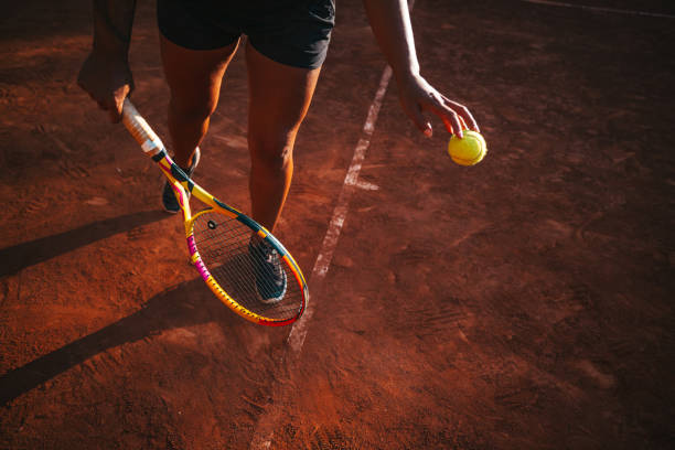 istock Professional tennis player serves 1573602288