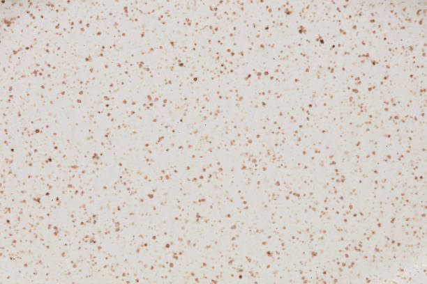 Beige and white ceramic texture of plate with dots.