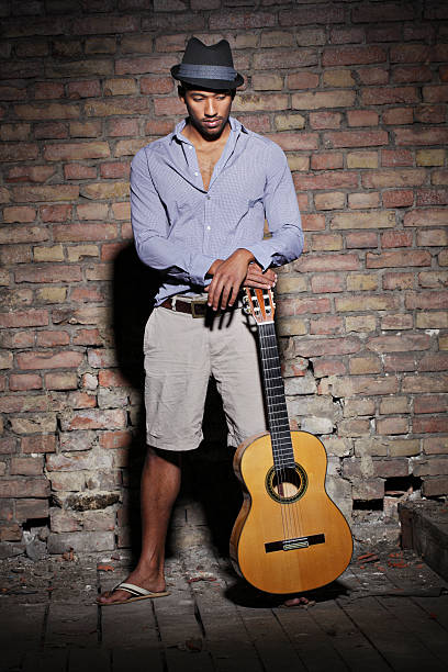 istock Portrait of a Man with Hat and guitar 157362637