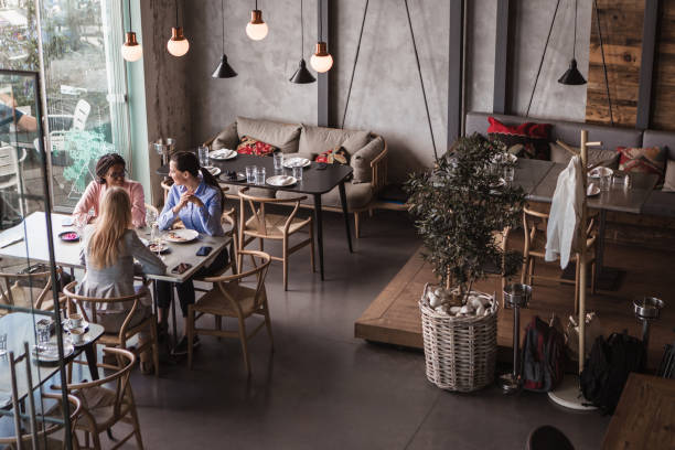 istock Business ladies talking in a restaurant 1573662176