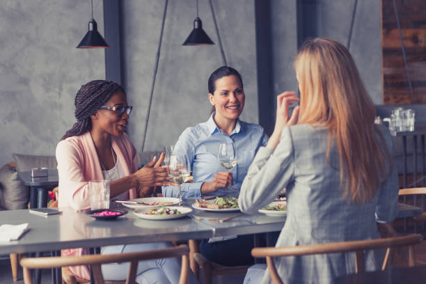 istock Business ladies talking in a restaurant 1573662657