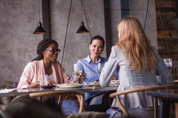 istock Business ladies talking in a restaurant 1573663087