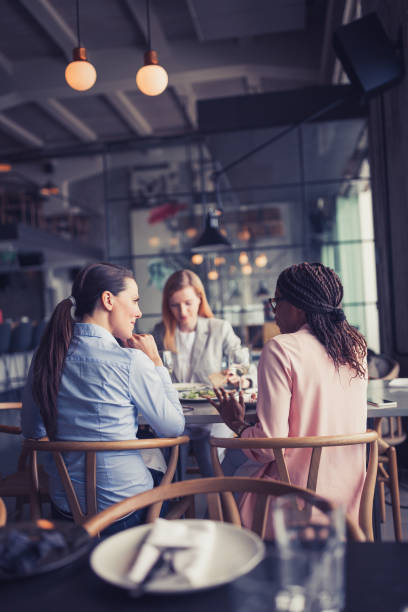 istock Business ladies talking in a restaurant 1573663858
