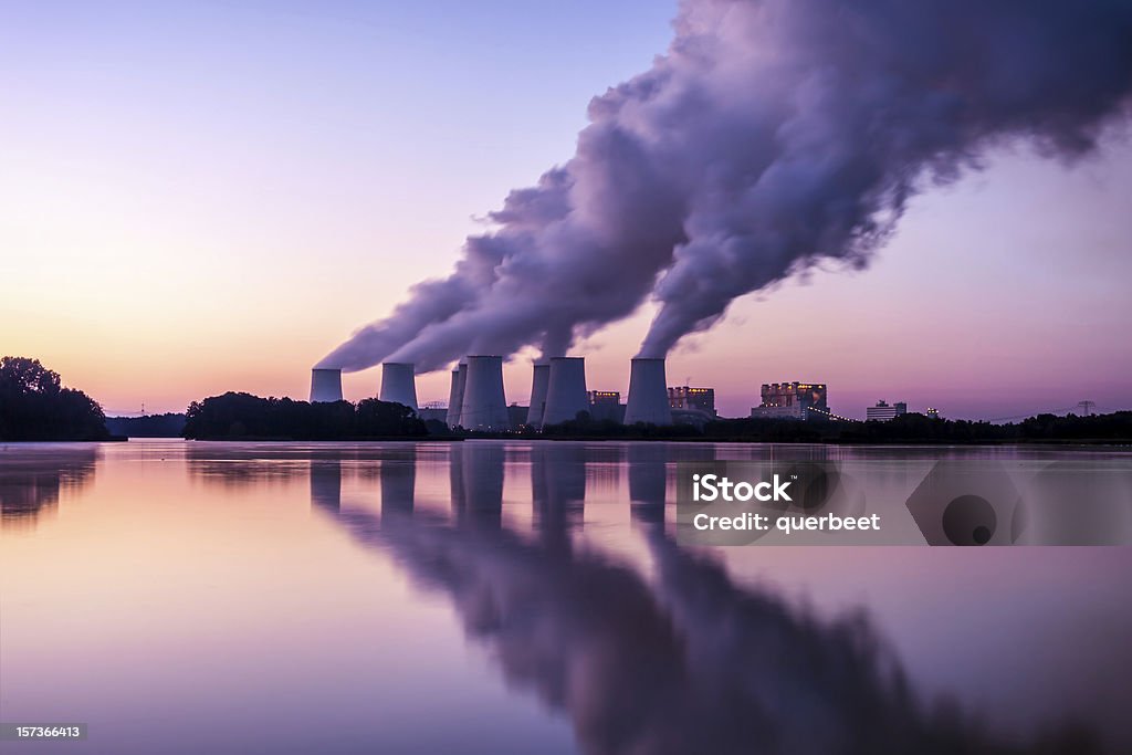 Power Plant in the sunrise Greenhouse Gas Stock Photo