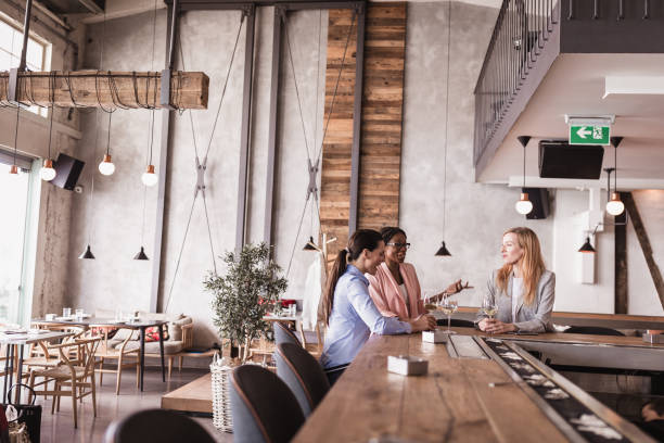 istock Business ladies talking in a restaurant 1573665265