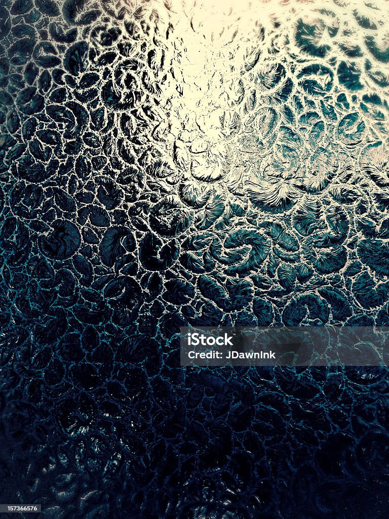 Close-up detail of a vintage frosted window Close up of an old fashioned, ornate frosted window texture on glass. Vertical background. Mobile stock taken with a phone. Backgrounds Stock Photo