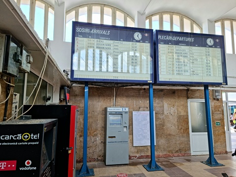 At București Basarab Railroad station. The image shows an arrival and departure board inside the old station building.