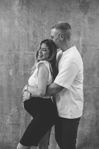 black and white shot of happy couple laughing and enjoying time together.